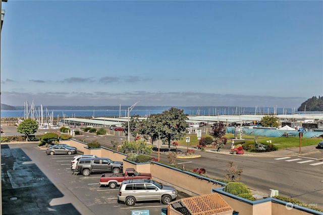 birds eye view of property with a water view