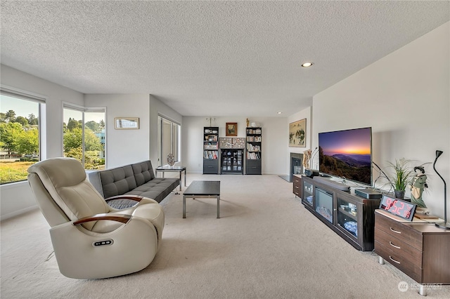 carpeted living room with a textured ceiling