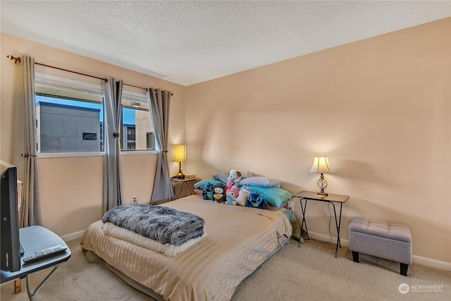 carpeted bedroom with a textured ceiling