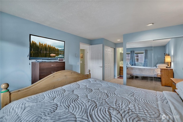 bedroom featuring a textured ceiling