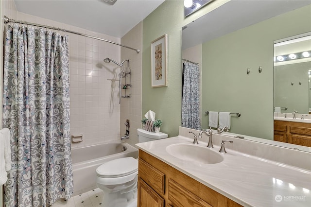 full bathroom with vanity, shower / bath combo with shower curtain, and toilet