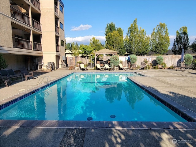 view of pool featuring a gazebo and a patio area