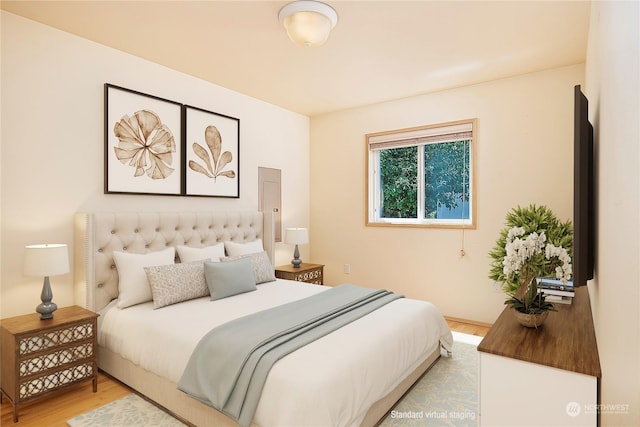 bedroom featuring light wood-style floors