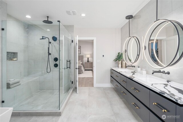 bathroom with hardwood / wood-style floors, a shower with shower door, and double vanity