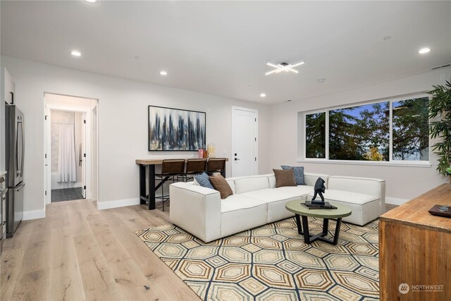 living room with light hardwood / wood-style floors