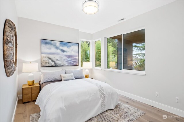 bedroom with light hardwood / wood-style flooring