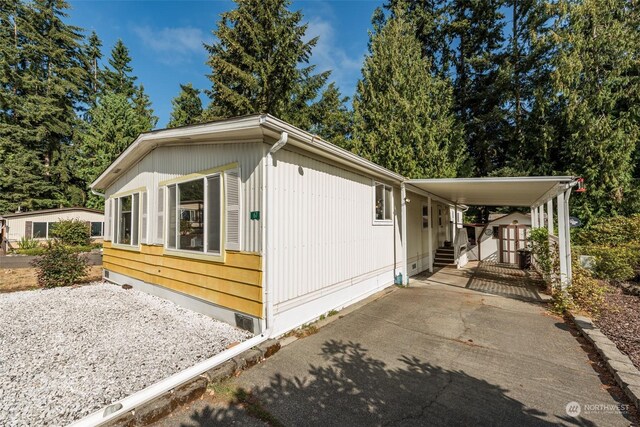 view of front of home featuring a carport