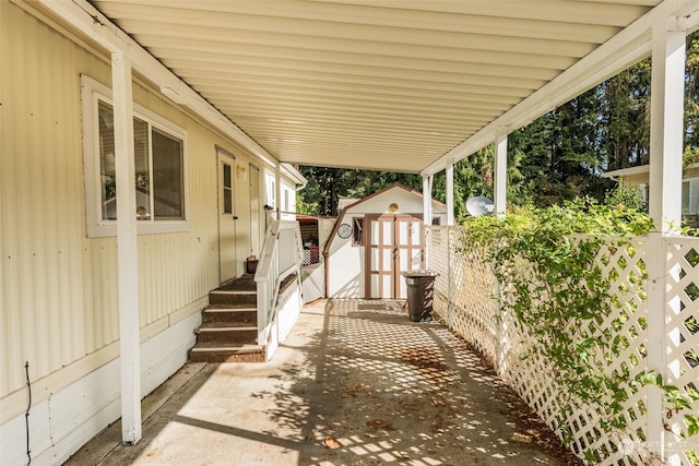 view of patio featuring a shed