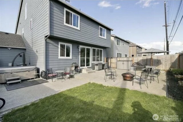 back of house featuring a yard and a patio