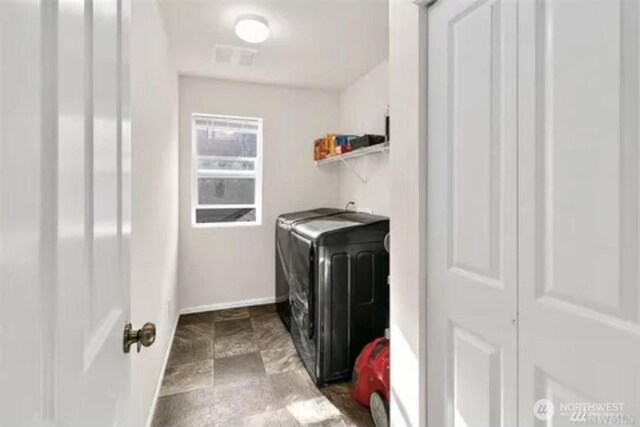 laundry area with washer and clothes dryer