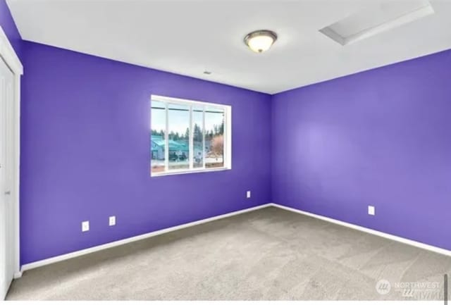 unfurnished room featuring carpet flooring