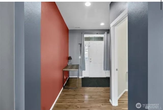 hallway featuring hardwood / wood-style floors