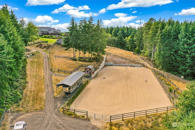 birds eye view of property with a rural view