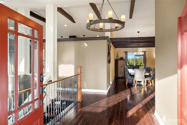 hallway featuring beam ceiling, a notable chandelier, hardwood / wood-style floors, an upstairs landing, and baseboards