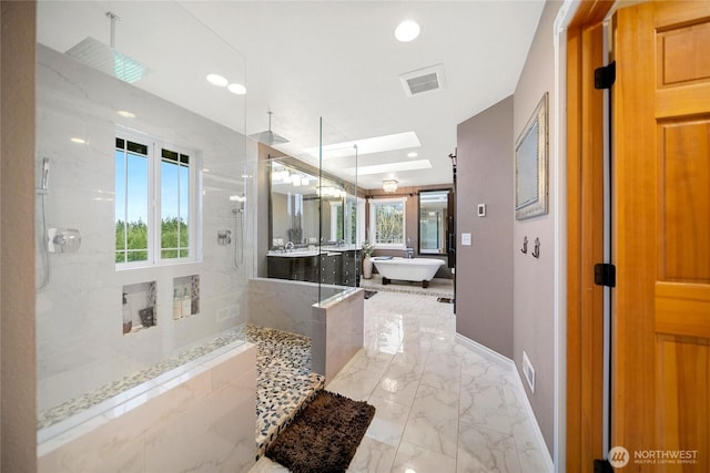 full bath with a skylight, a marble finish shower, visible vents, marble finish floor, and a freestanding bath