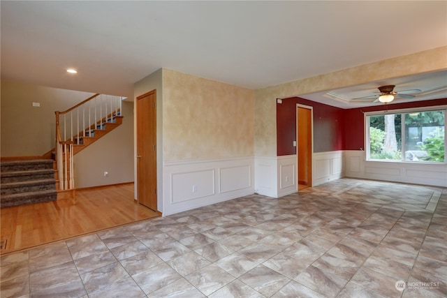 empty room featuring ornamental molding, light hardwood / wood-style floors, and ceiling fan