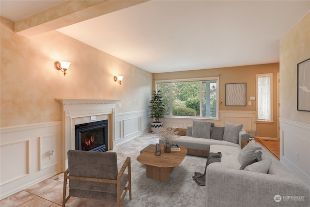 tiled living room with beamed ceiling