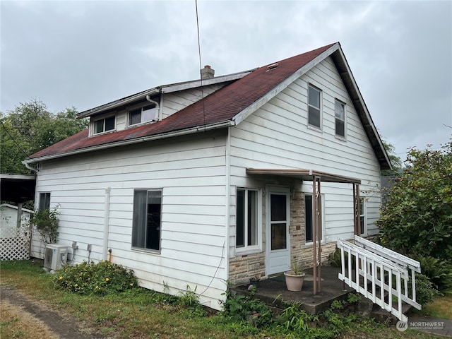 back of property with central air condition unit