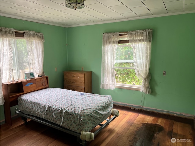 bedroom with wood-type flooring