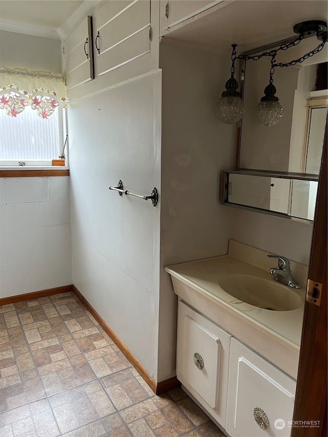 bathroom with tile patterned floors and vanity