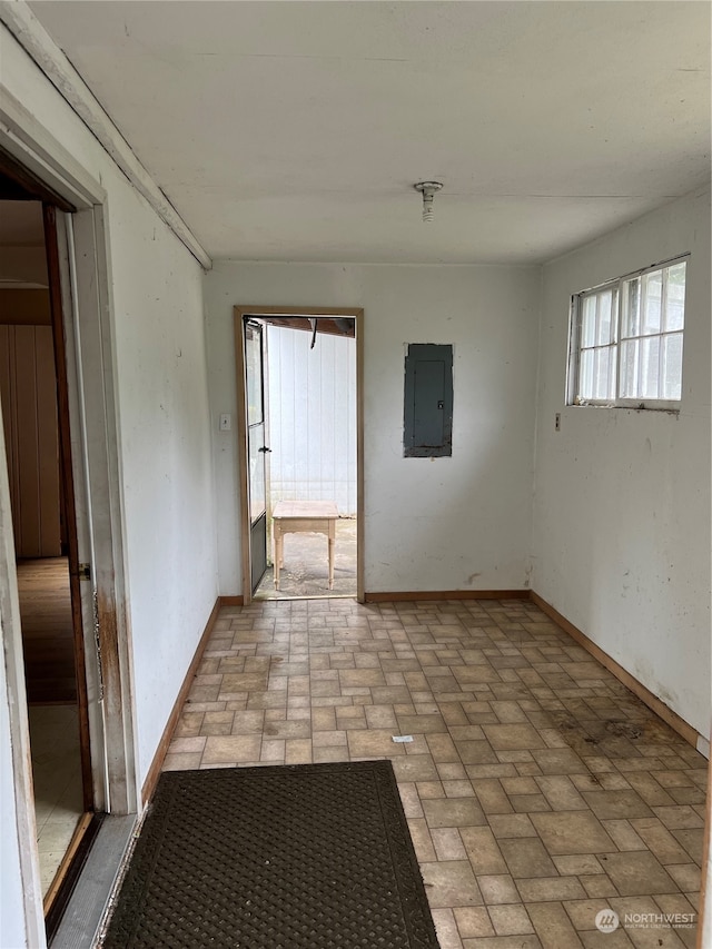 tiled spare room with electric panel