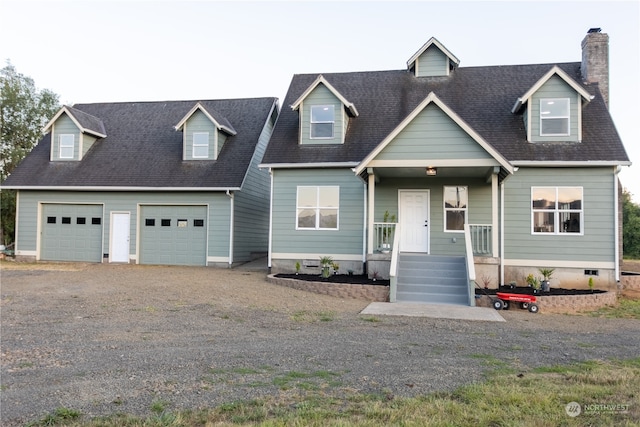 cape cod house with a garage