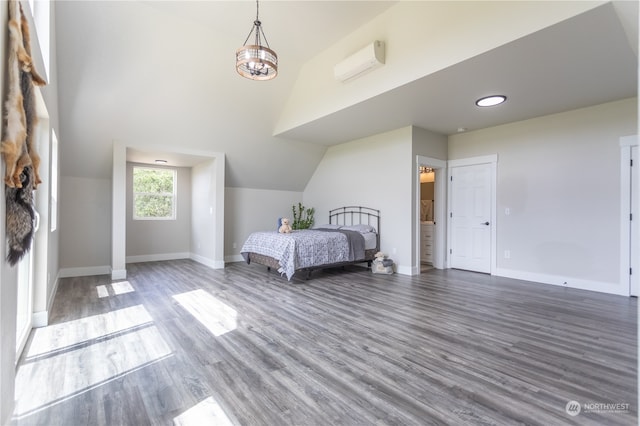 unfurnished bedroom featuring wood-type flooring and lofted ceiling