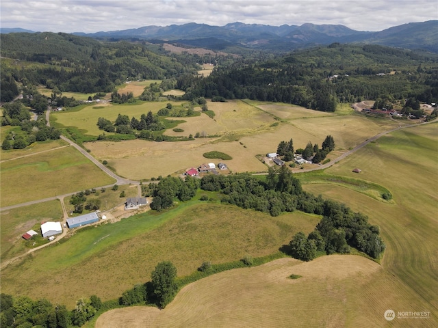 drone / aerial view featuring a rural view and a mountain view