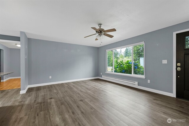 unfurnished living room with hardwood / wood-style flooring, ceiling fan, and a baseboard heating unit