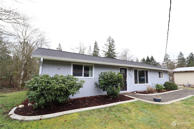 ranch-style house with a front yard