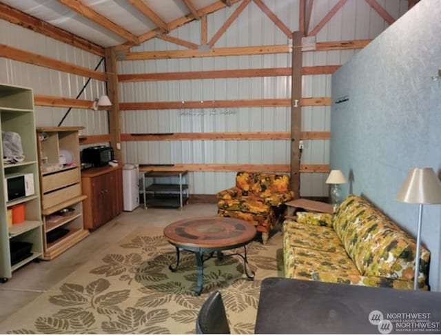 interior space featuring lofted ceiling with beams