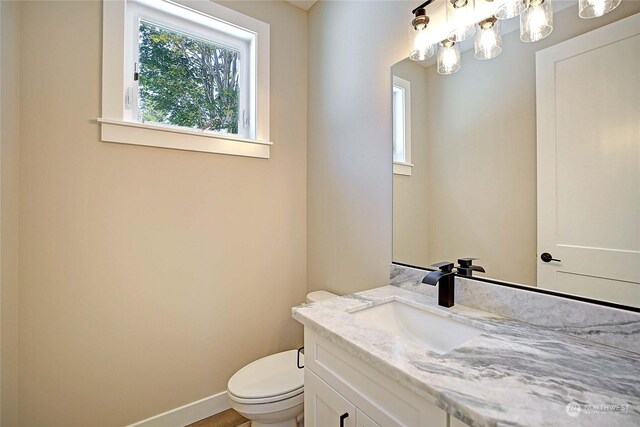 bathroom with vanity and toilet