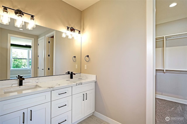 bathroom with vanity and a shower with shower door