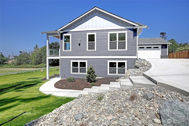 view of front facade with a front yard and a garage