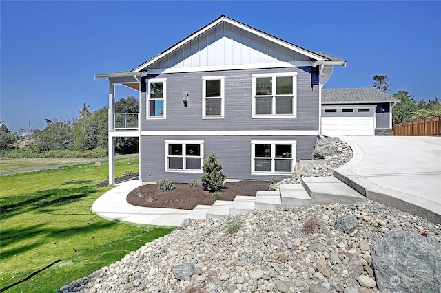 view of front of house with a front lawn and a garage