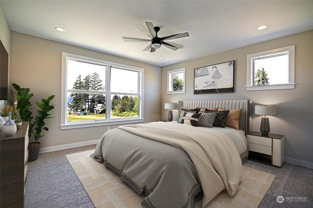 carpeted bedroom with ceiling fan