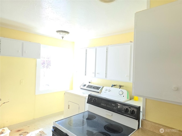 kitchen with white cabinets, light countertops, independent washer and dryer, and white electric stove