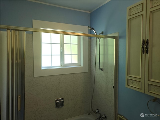 full bath with crown molding and shower / bathing tub combination