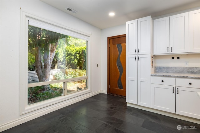 interior space featuring baseboards, visible vents, and recessed lighting