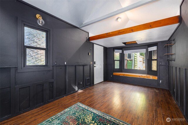 entrance foyer with lofted ceiling with beams and dark wood-type flooring