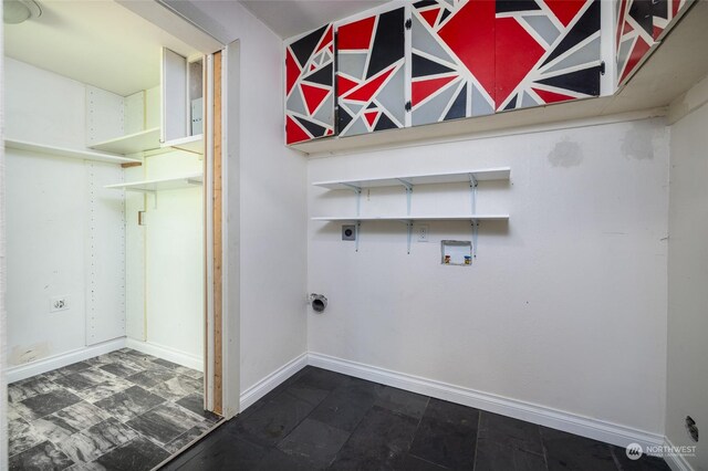 washroom with hookup for an electric dryer, washer hookup, and tile patterned flooring