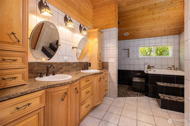 bathroom with wood ceiling, tile walls, tile patterned floors, dual bowl vanity, and a washtub