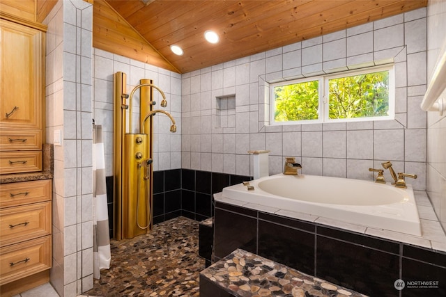 bathroom with a garden tub, tile walls, lofted ceiling, recessed lighting, and wooden ceiling