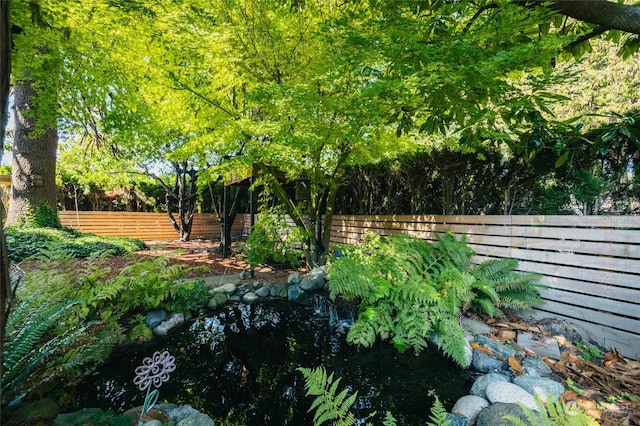 view of yard with fence