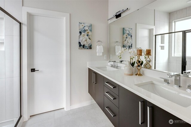 bathroom with vanity, tile patterned flooring, and a shower with door