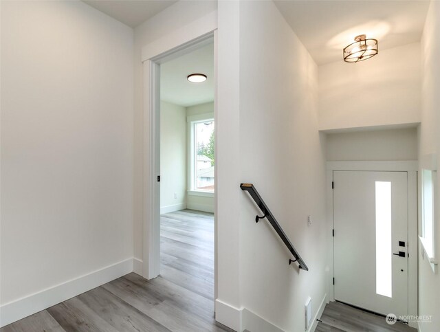 foyer entrance with light hardwood / wood-style floors