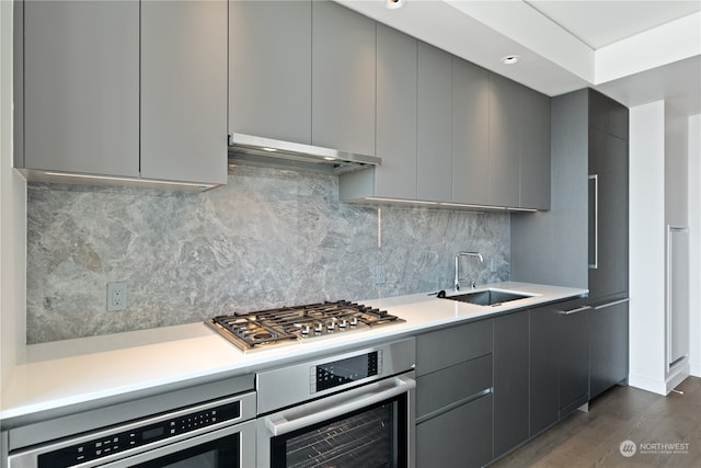 kitchen featuring gray cabinets, appliances with stainless steel finishes, and sink