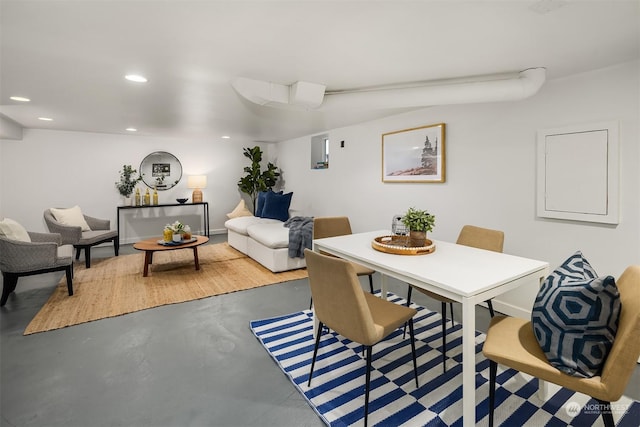 dining room with concrete flooring