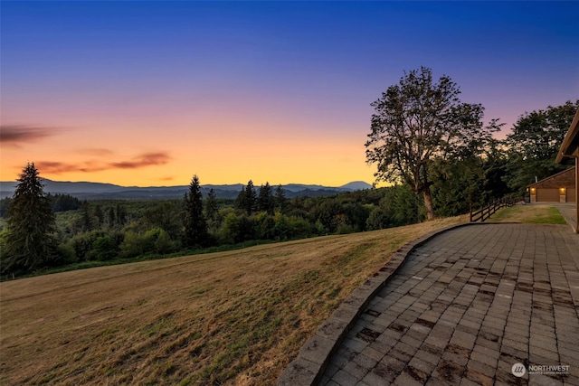 exterior space with a patio and a mountain view