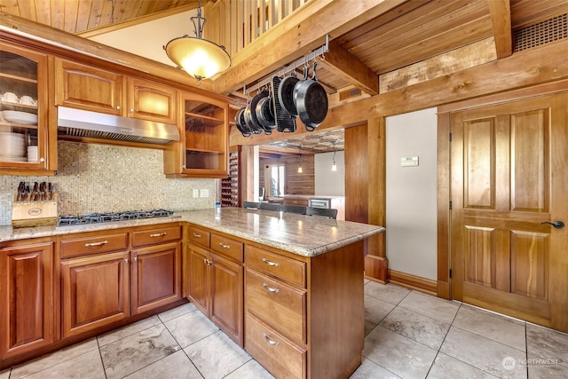 kitchen with stainless steel gas cooktop, kitchen peninsula, wooden ceiling, decorative light fixtures, and light tile patterned floors